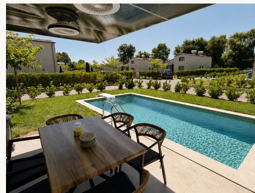 Private pool and outdoor dining terrace at Ledore Villas