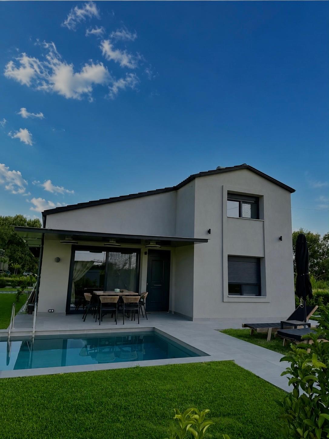 Ledore Villa exterior with a private heated pool and garden
